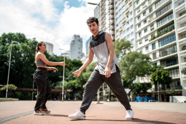 istock Young man dancing with friends outdoors 1486078740