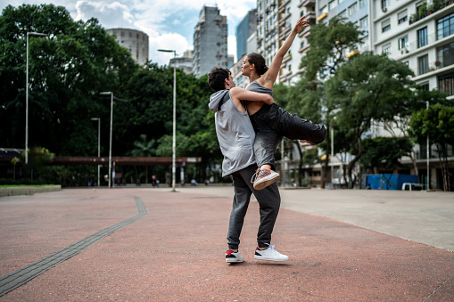 Young couple dancing outdoors