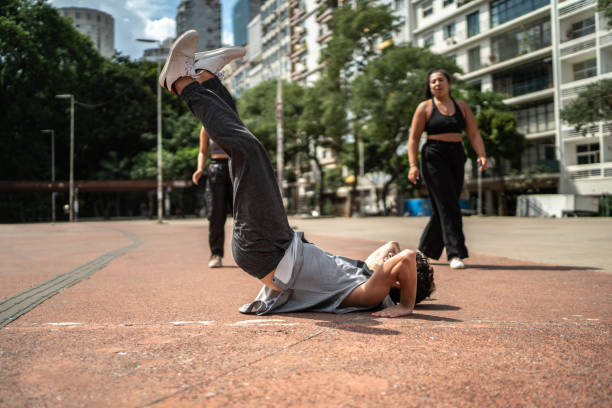 istock Young man dancing with friends outdoors 1486078775