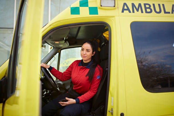 istock Female ambulance driver sitting in yellow van 1486078888