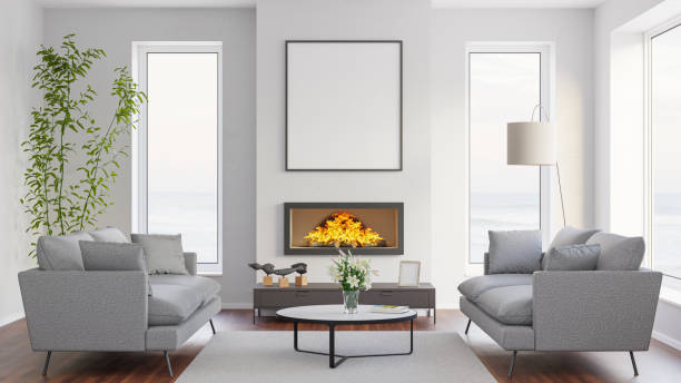 istock Model apartment at the sea. Sofas, Lilies in vase, fireplace with fire, mockup picture frame, windows to the sea. 1486078966