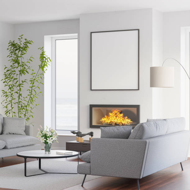 istock Model apartment at the sea. Sofas, Lilies in vase, fireplace with fire, mockup picture frame, windows to the sea. 1486078980