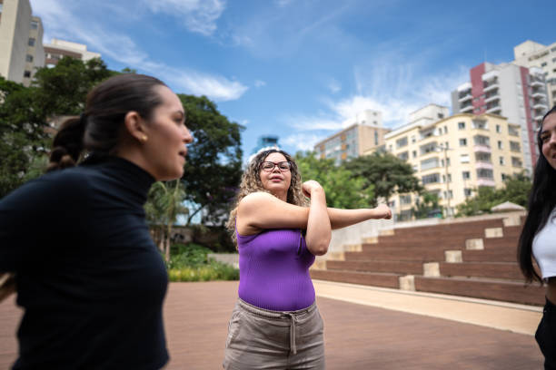 istock Friends stretching outdoors 1486079655