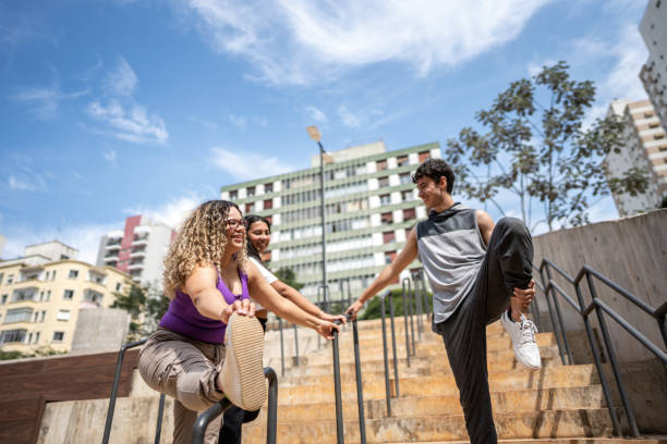 istock Friends stretching outdoors 1486080306