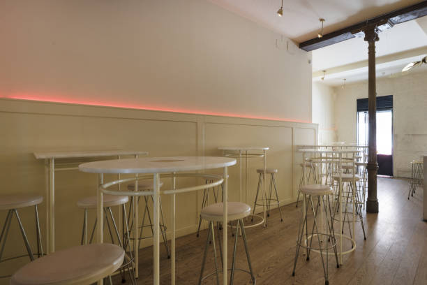 istock Circular high tables with matching stools in a restaurant hall 1486081195
