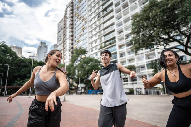 istock Friends dancing outdoors 1486081581