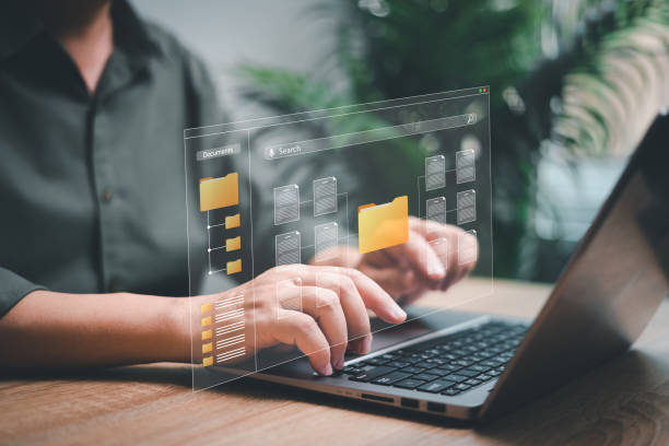 istock Data management and document network system concept, Businessman use laptop search for documents in online archives ,Document management Storage and technology on digital document paperless operation 1486082985