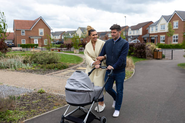 istock Happy Couple Walking With Newborn Daughter 1486083581