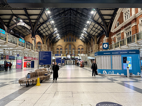People at Liverpool Street station - opened in 1874 it is third busiest and one of the main railway stations in UK, witn connection to London Underground.