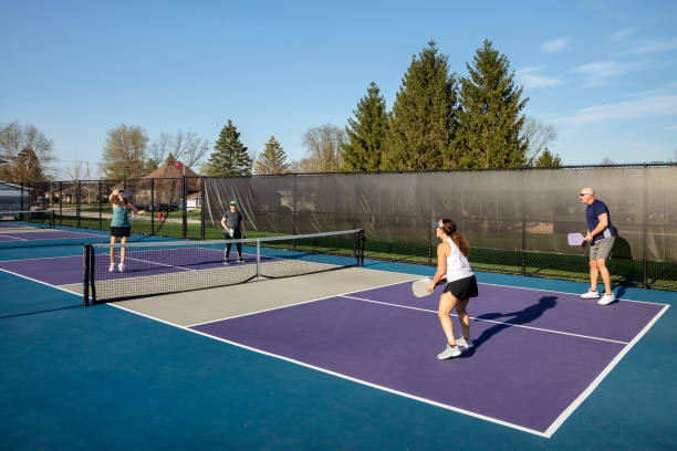 istock Female Pickleball Player Returning High Volley 1486086990
