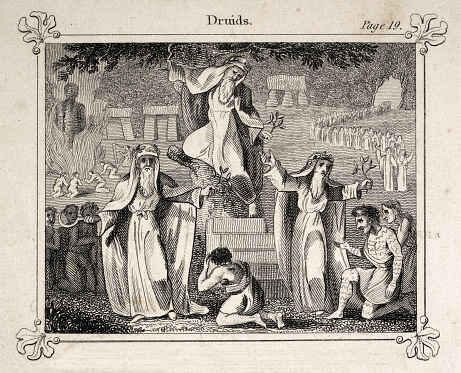 Vintage illustration, Ancient Druids of Britain, Stone circle, henge, burning Wicker man Human sacrifice. Druids were members of the learned class among the ancient Celts. They acted as priests, teachers, and judges.  Image created 1825