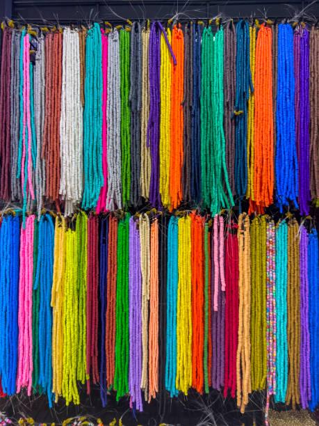 istock Strings of  mixed colorful jewellery beads hanging 1486092989