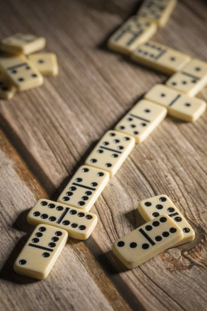 istock several tiles of classic dominoes are lying on the table 1486093604