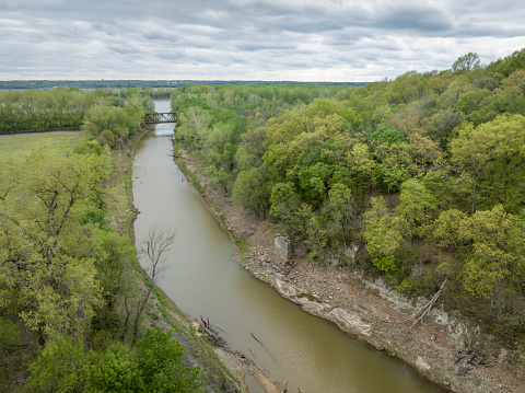 aerial view of Missouri River valley above Jefferson City, MO, with Katy Trail crossing Cedar Creek, cloudy spring afternoon