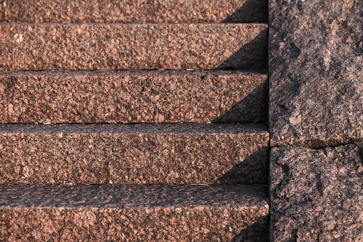 Empty outdoor granite stairs with shadows on it. Abstract photo