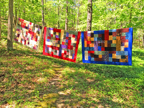 Handmade quilts on a clothesline in the Ozark Mountains
