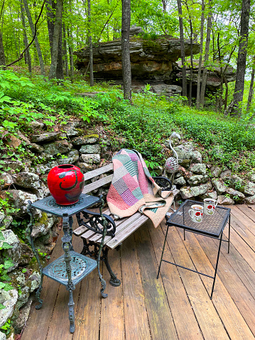 Outdoor teatime on a park bench in the Ozark mountains.