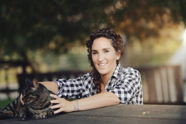 istock a cute tiger cat enjoys cuddles 1486099459