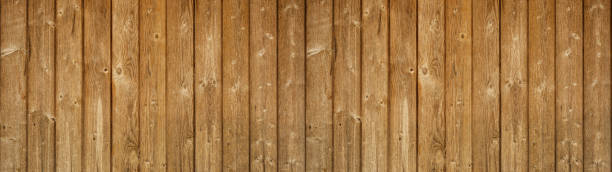 istock old brown rustic light bright wooden texture - wood background panorama banner long 1486100933