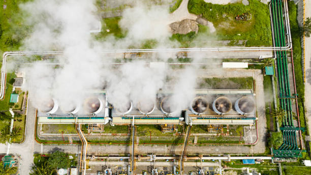 Geothermal power station in the mountains. Aerial view of geothermal power plant in a mountainous province. Renewable energy production at a power station. Negros, Philippines. hot spring stock pictures, royalty-free photos & images