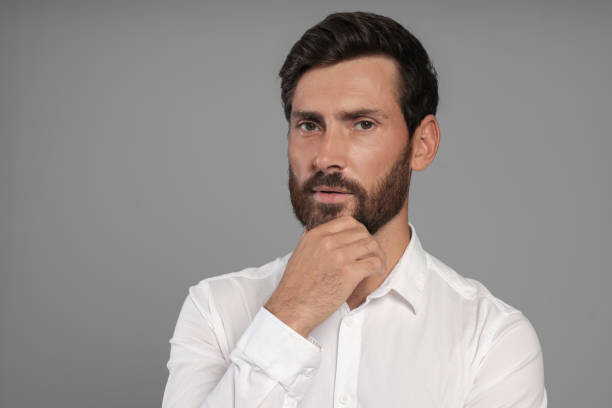 istock Portrait of handsome bearded man on grey background, space for text 1486102247