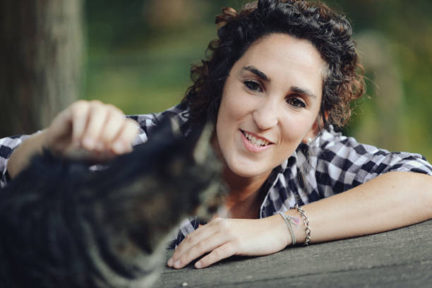istock a cute tiger cat enjoys cuddles 1486102907