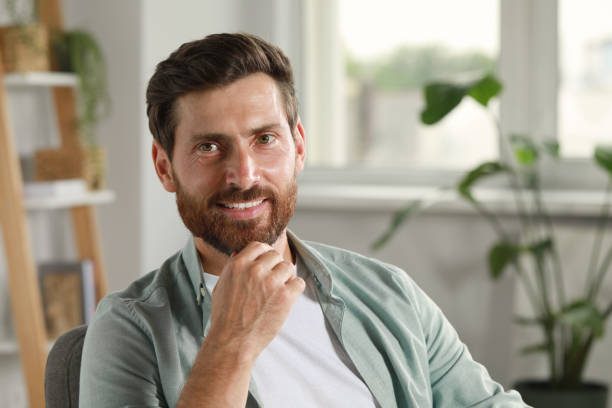istock Portrait of handsome bearded man at home, space for text 1486103833