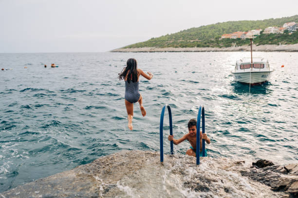 istock Girl jumping from a cliff 1486105641