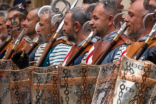 04-22-2023 Alcoy, Spain. Navarros Squad with shields and weapons in the Moors and Christians parade