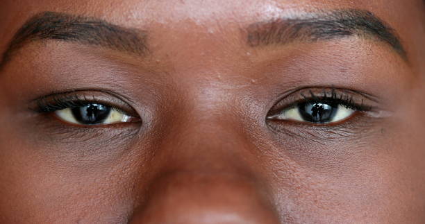 istock Mixed race black woman opening eyes looking at camera 1486109004
