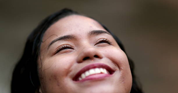 istock Joyful smiling hispanic woman face in the rain 1486109041