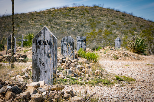 Tombstone, Arizona, USA - March 27, 2023: A few of the unknown graves in the old west Boothill cemetery near the town.
