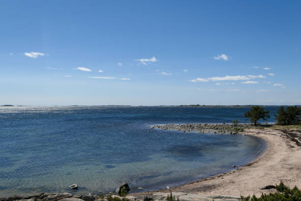 istock Scenic view of beach against blue sky 1486111382