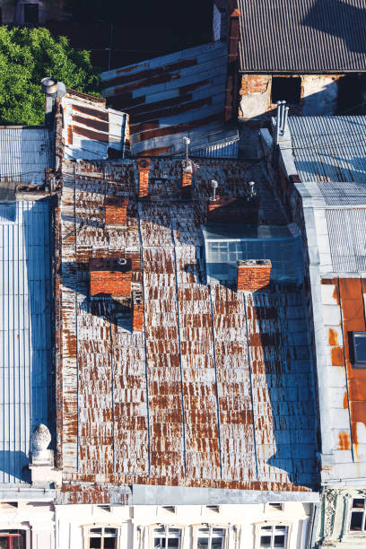 istock old rusty galvanized iron roof, chimneys and roof windows 1486112802