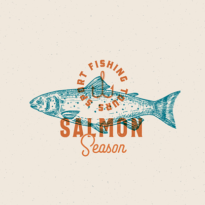 Salmon Fishing Season. Abstract Vector Sign, Symbol or Logo Template. Hand Drawn Salmon Fish with Classy Retro Typography. Vintage Vector Emblem with Retro Print Effect and Shabby Texture. Isolated.