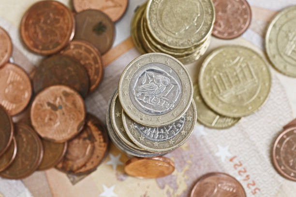 istock Euro coins and banknotes on the table. 1486114931