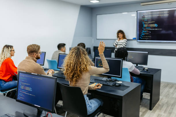 istock Mid Adult Female Teacher Teaching A Programing Class 1486115007