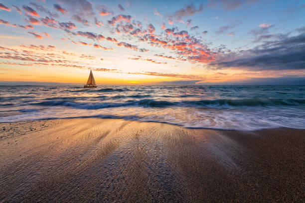 istock Sunset Beautiful Sailboat Colorful Ocean Inspirational 1486116031