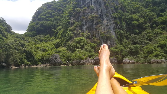 Kayaking through Halong bay view from the first person. Enjoying the beautiful view of Vietnam and Thailand