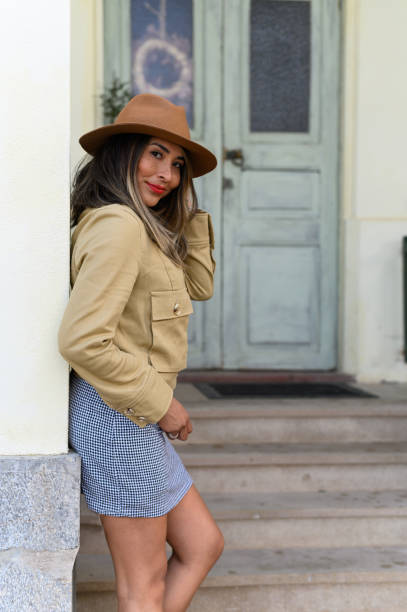 istock Sensual model wearing hat posing next to a house 1486118832