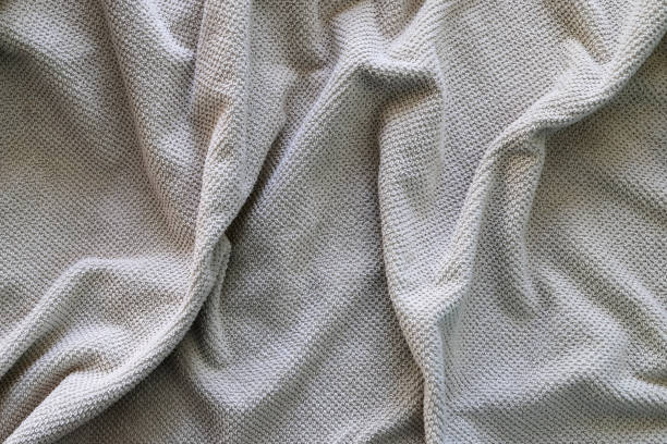 istock Texture of a wavy surface of a yellow terry fabric as a background 1486121288