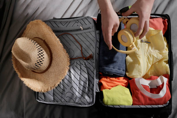 istock hands packing to go to the beach 1486128793