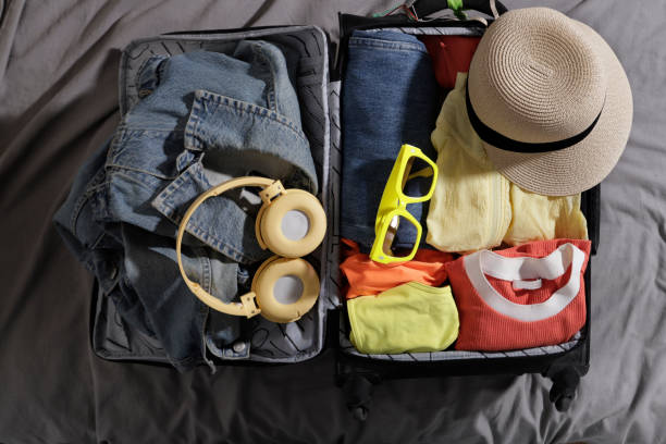 istock top view of suitcase withcamera and headphones 1486128806