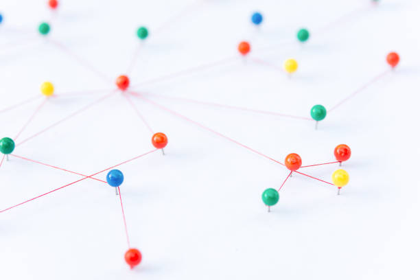 istock Linking entities, Blockchain, social media, Communications Network, The connection between the two networks. Network simulation on paper linked together by yarn 1486128887