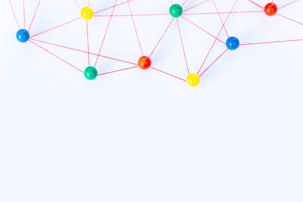 istock Linking entities, Blockchain, social media, Communications Network, The connection between the two networks. Network simulation on paper linked together by yarn 1486128901
