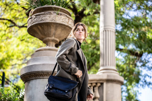 istock Young woman looking around while walk outdoors 1486129746