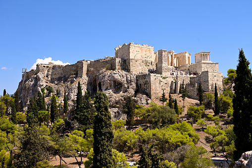 Elevated, panoramic view of the illuminated Acropolis of Athens, Greece, with the Parthenon Temple and the old town Plaka during dusk