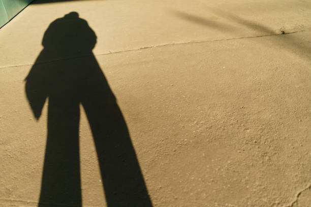 istock The shadow of a man with bag. 1486133908