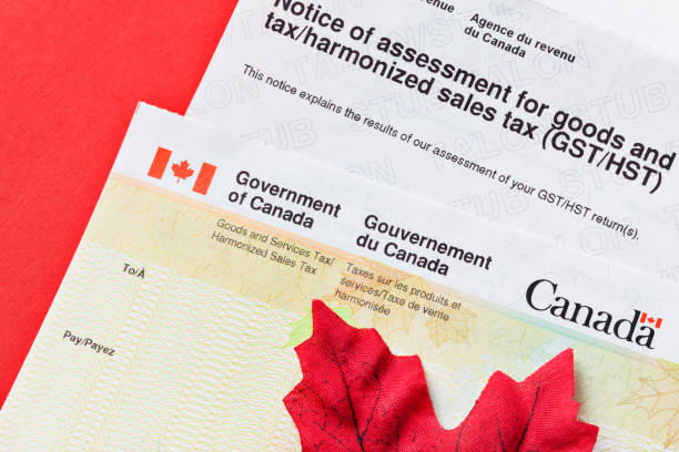 istock Government of Canada Tax Assessment Form and Refund Check with Maple Leaf 1486136835