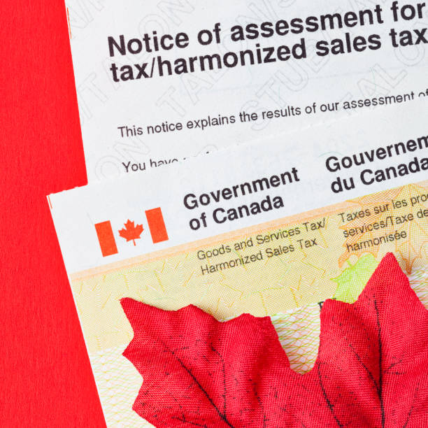 istock Government of Canada Tax Assessment Form and Refund Check with Maple Leaf 1486136837